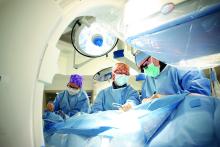 Photo from May 28, 2013: TAVI (Transcatheter Aortic Valve Implantation) being performed at Kingston General Hospital. Michael Hurley, president of OCHU/CUPE, points out that staff are leaving hospitals for better pay at private clinics, which “only take the easiest to perform surgeries.”